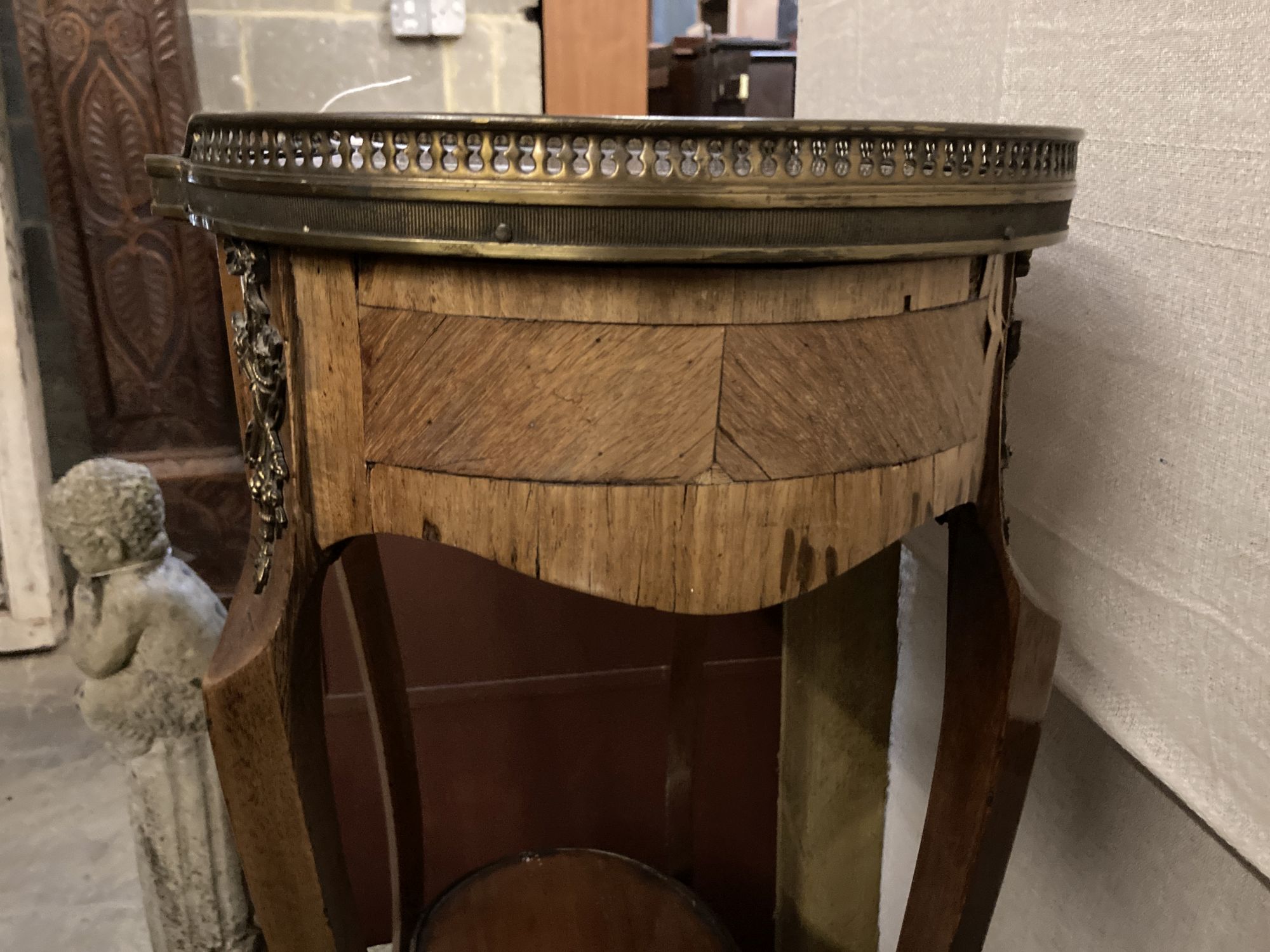 A Louis XVI style kidney top side table, with gilt brass gallery over a single drawer and upper tier, on slender cabriole supports, wid